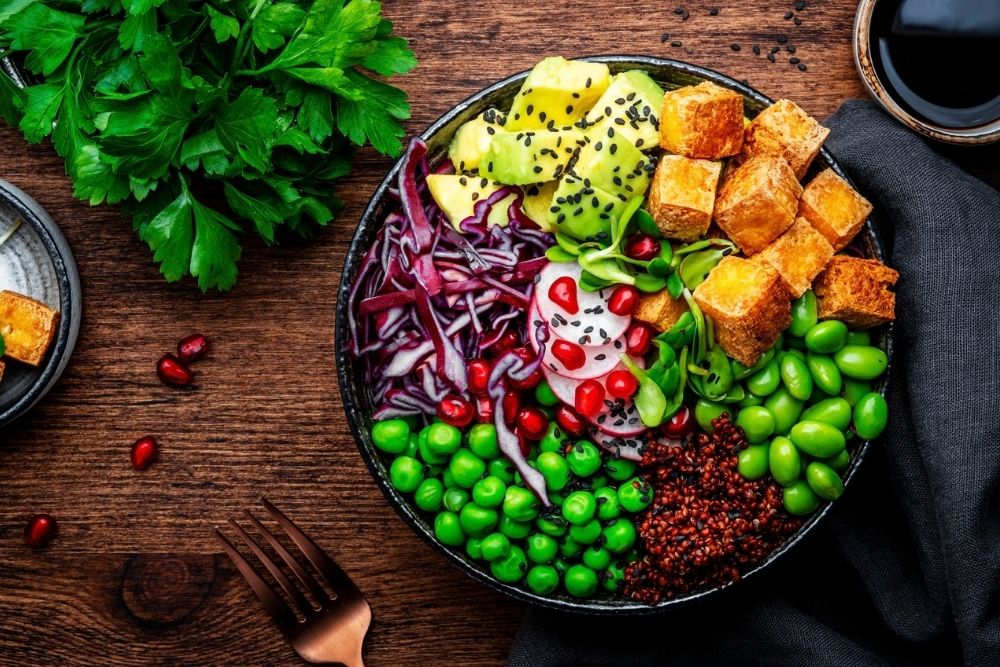Plant-based bowl with tofu, quinoa, vegetables and legumes